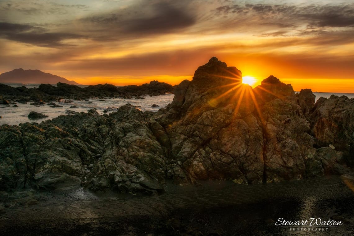 Sunrise flare at Kaikoura wharf at sunrise