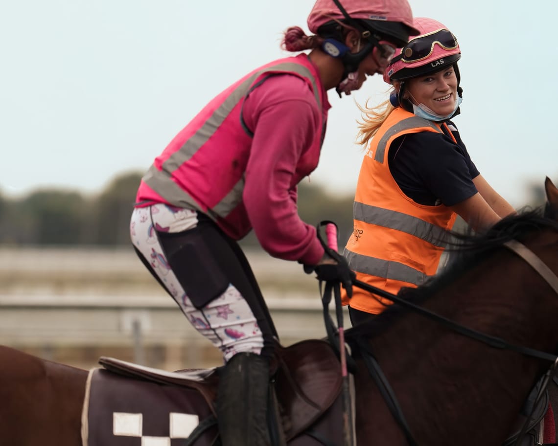 Two women on racehorses