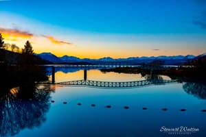 Lake Tekapo footbridge over Scott Pond at sunset