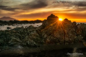 Sunrise flare at Kaikoura wharf at sunrise